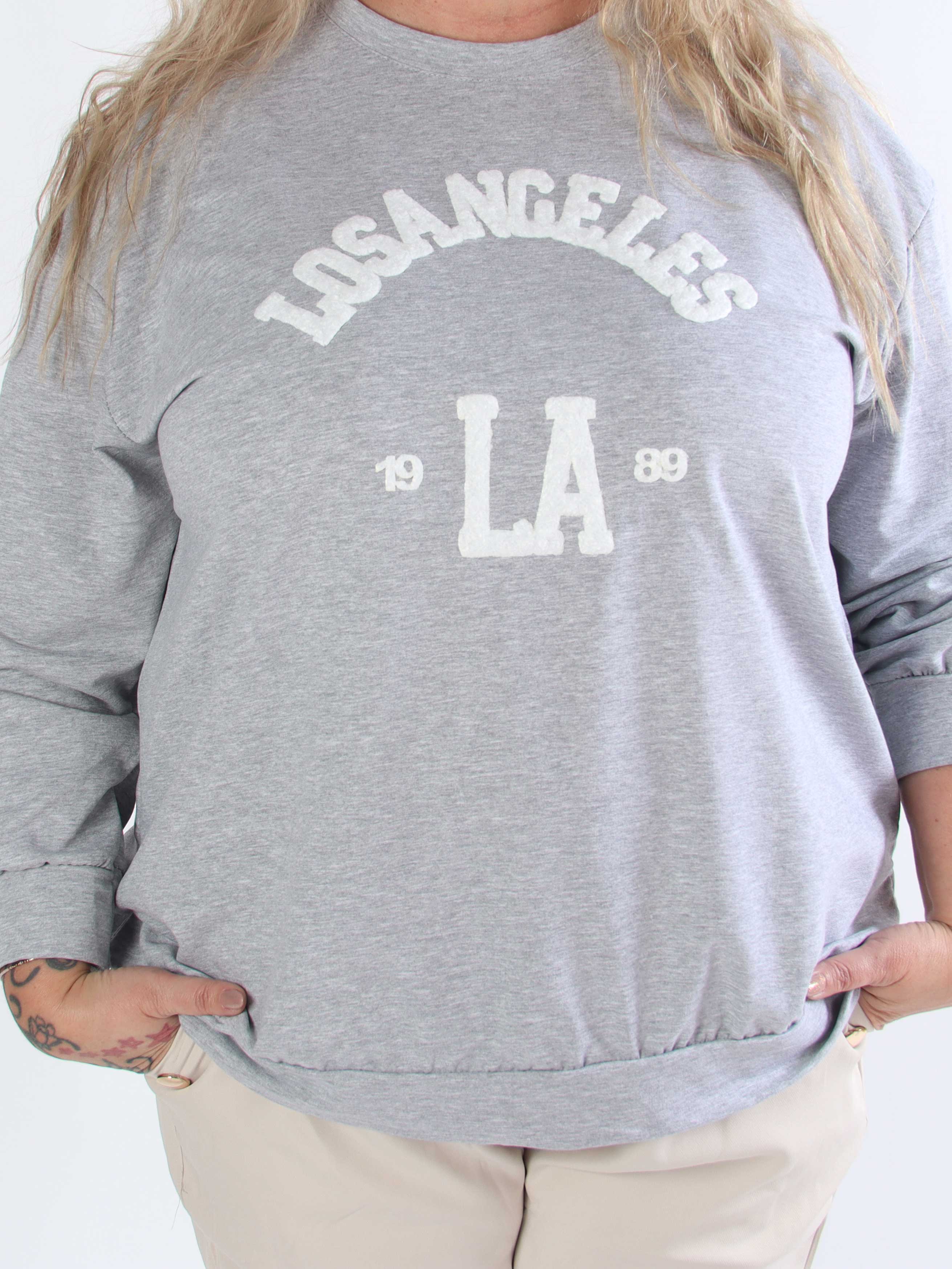 Magnolia - Plus size joggingtopp med LA skrivet i plysch